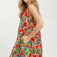 Red sleeveless shift dress, side view, colorful floral abstract print