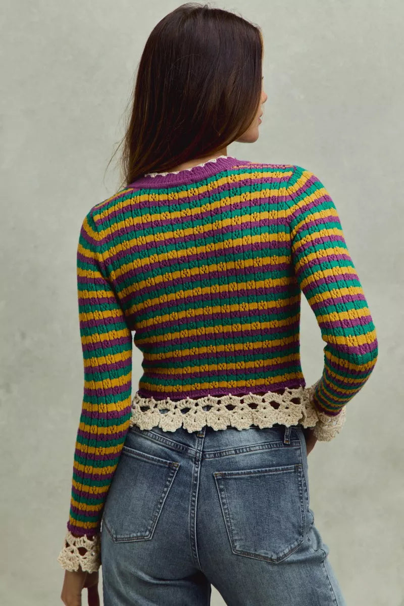 Back view of multicolor striped cropped knit top with crochet hem and long sleeves