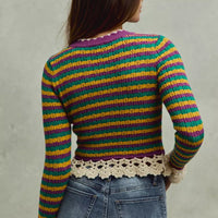 Back view of multicolor striped cropped knit top with crochet hem and long sleeves