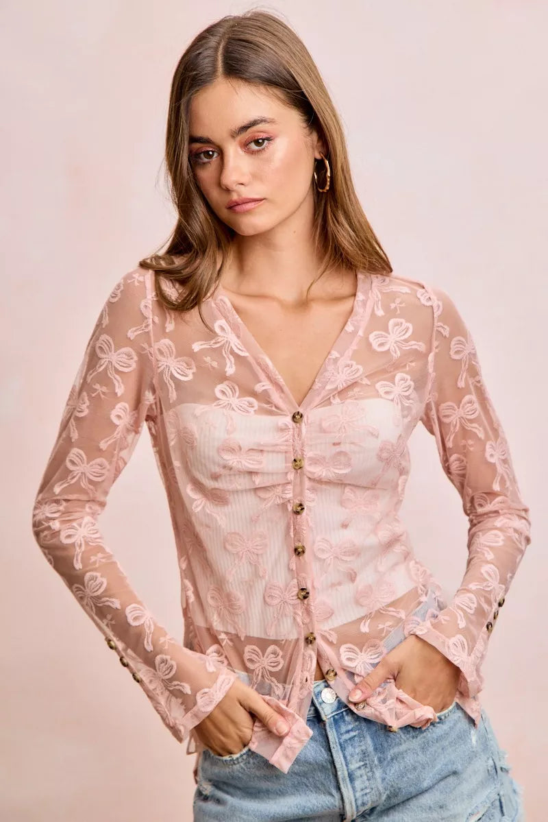 Dusty rose mesh V-neck cardigan with button front, shirred waist, long sleeves, bow-pattern print
