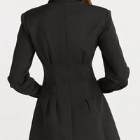 Black blazer mini dress back view with structured seam lines and flared skirt.