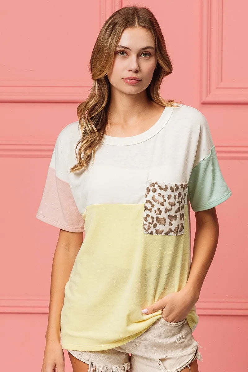 Color block crew neck top with leopard pocket detail, short sleeves and pale yellow front
