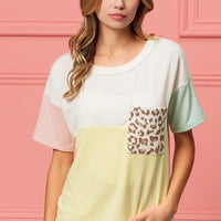Color block crew neck top with leopard pocket detail, short sleeves and pale yellow front