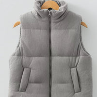 Gray corduroy puffer vest, stand collar, full front zipper; quilted padded front and back.