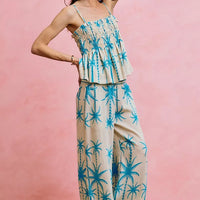 Blue palm tree print smocked bodice adjustable cami top with tiered ruffle front
