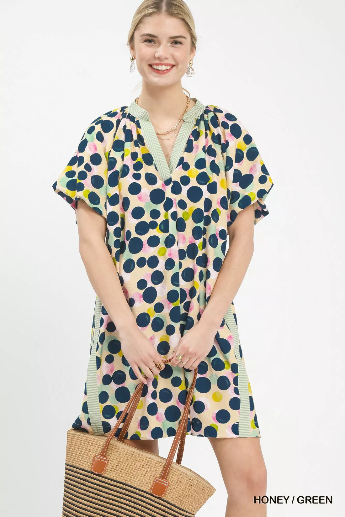 Polka dot tunic dress with V-neck and short sleeves, honey/green with pink accents