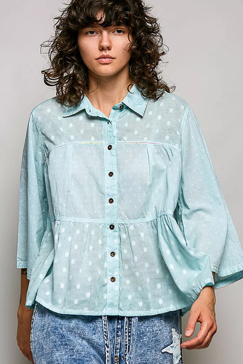 Aqua button-front peplum shirt with white polka dots, long sleeves and point collar