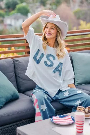 Ivory french terry top with blue "USA" appliqued letters, loose short sleeves and hem