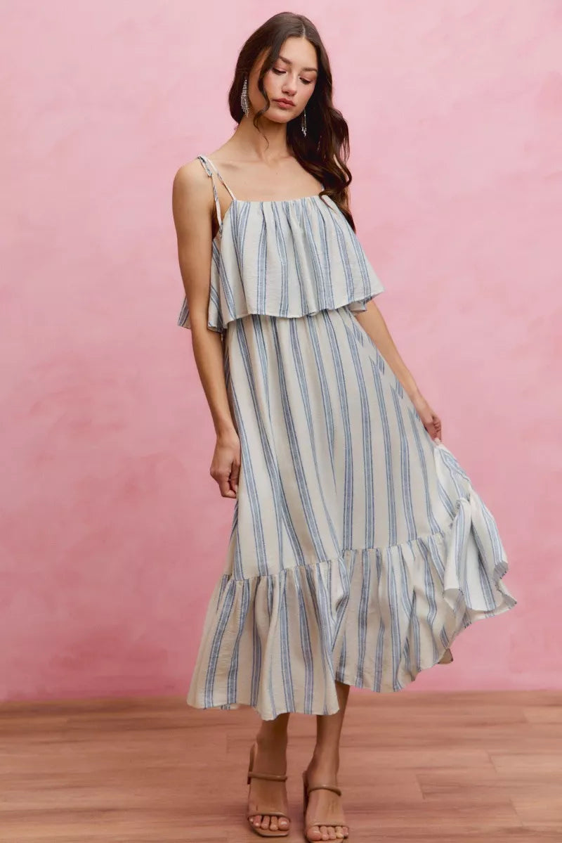 Sleeveless striped midi dress with ruffled tiered skirt and tie shoulder straps, blue and white