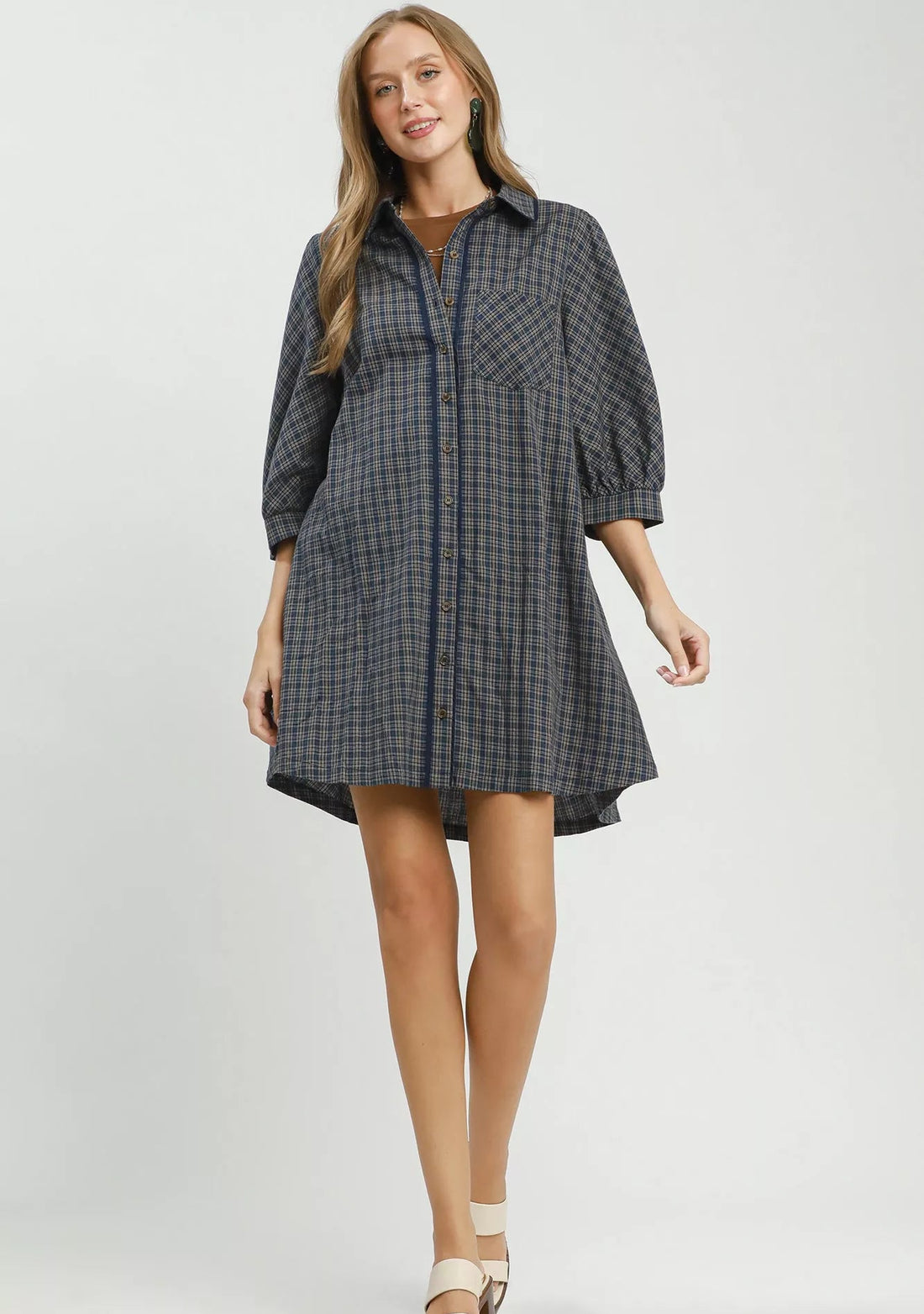 Navy plaid oversized shirt dress with collared neckline and three-quarter sleeves