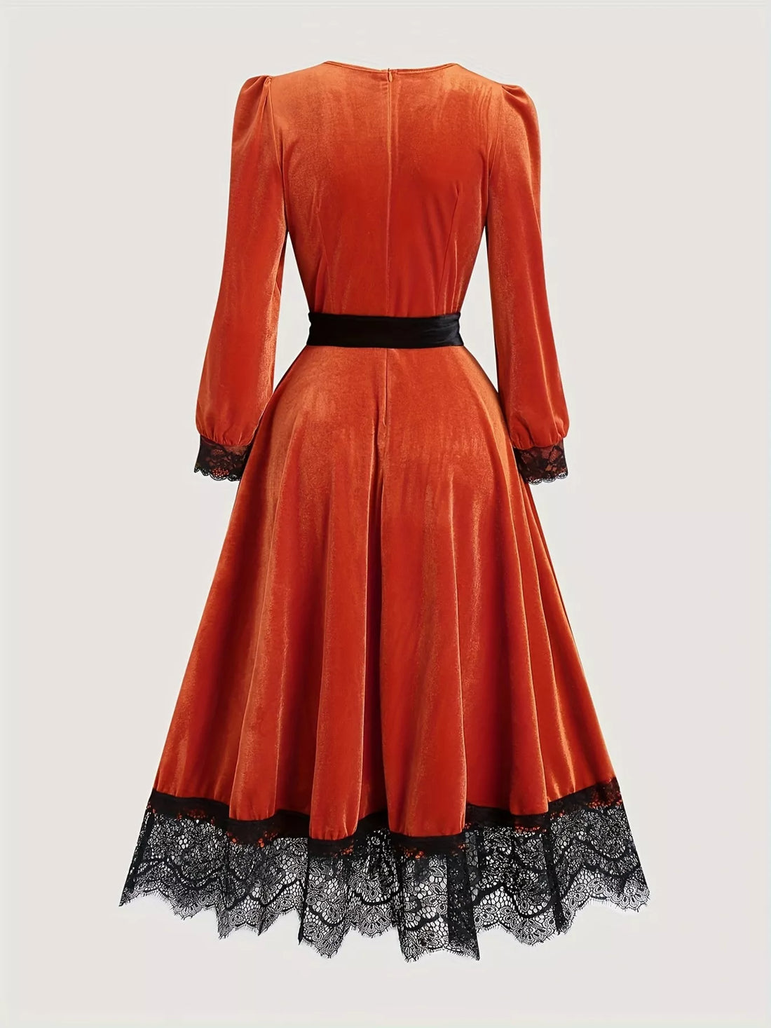 Orange-red velvet midi dress with black lace hem, long sleeves, fitted waist with tie belt