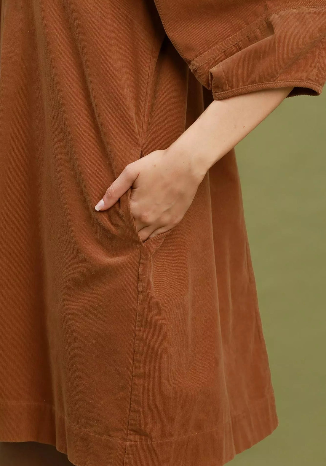 Camel brown corduroy shift dress close-up of front pocket and seam details