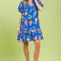 Blue floral mini dress with V-neck, ruffle tiers, and puff sleeves