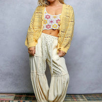 Yellow open-knit button cardigan, relaxed fit with long sleeves and ribbed cuffs