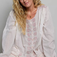 Embroidered gathered-shoulder long-sleeve shirt in off-white with blush floral pattern