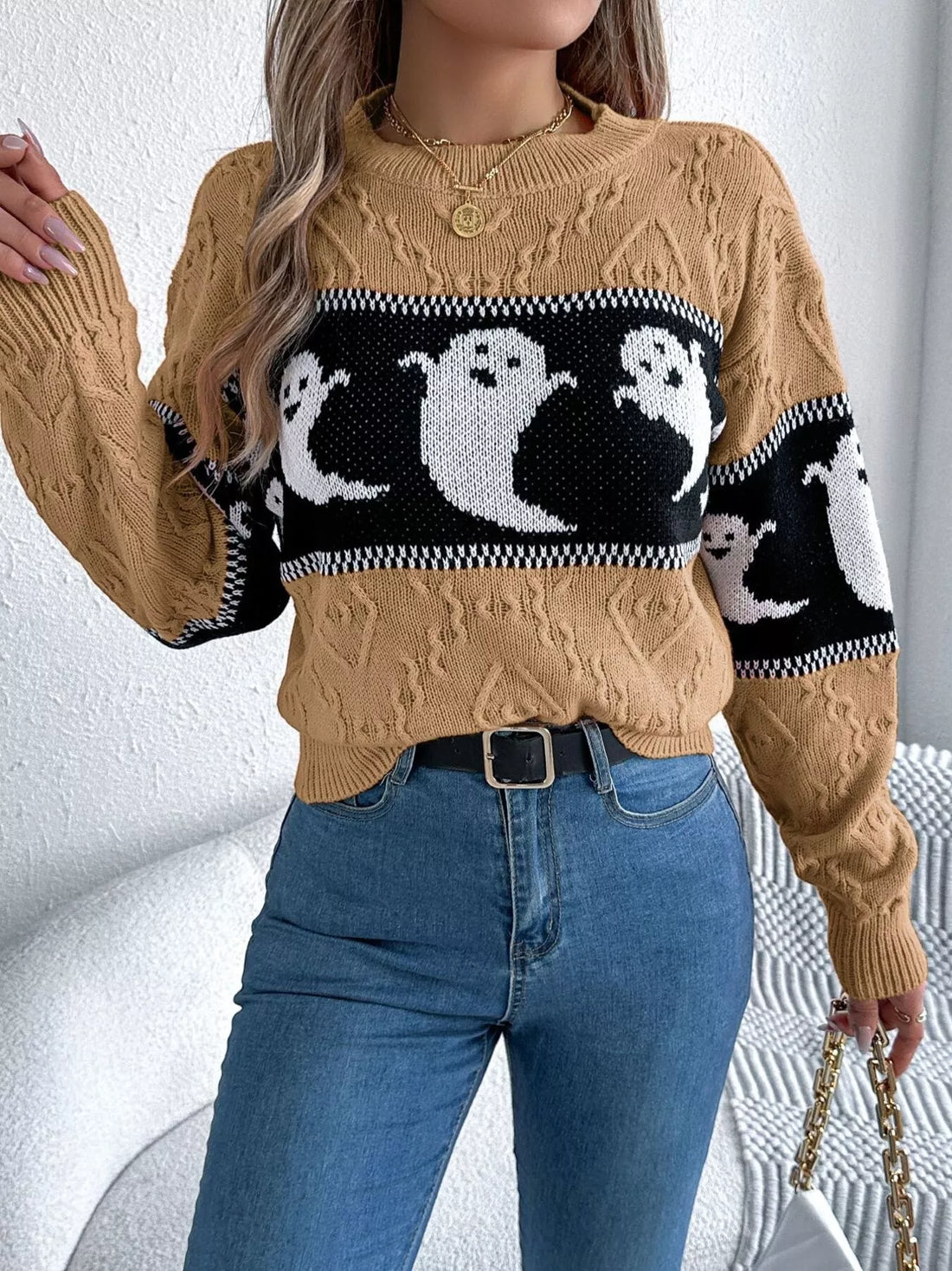 Camel sweater with black-and-white ghost knit panel, ribbed crew neckline