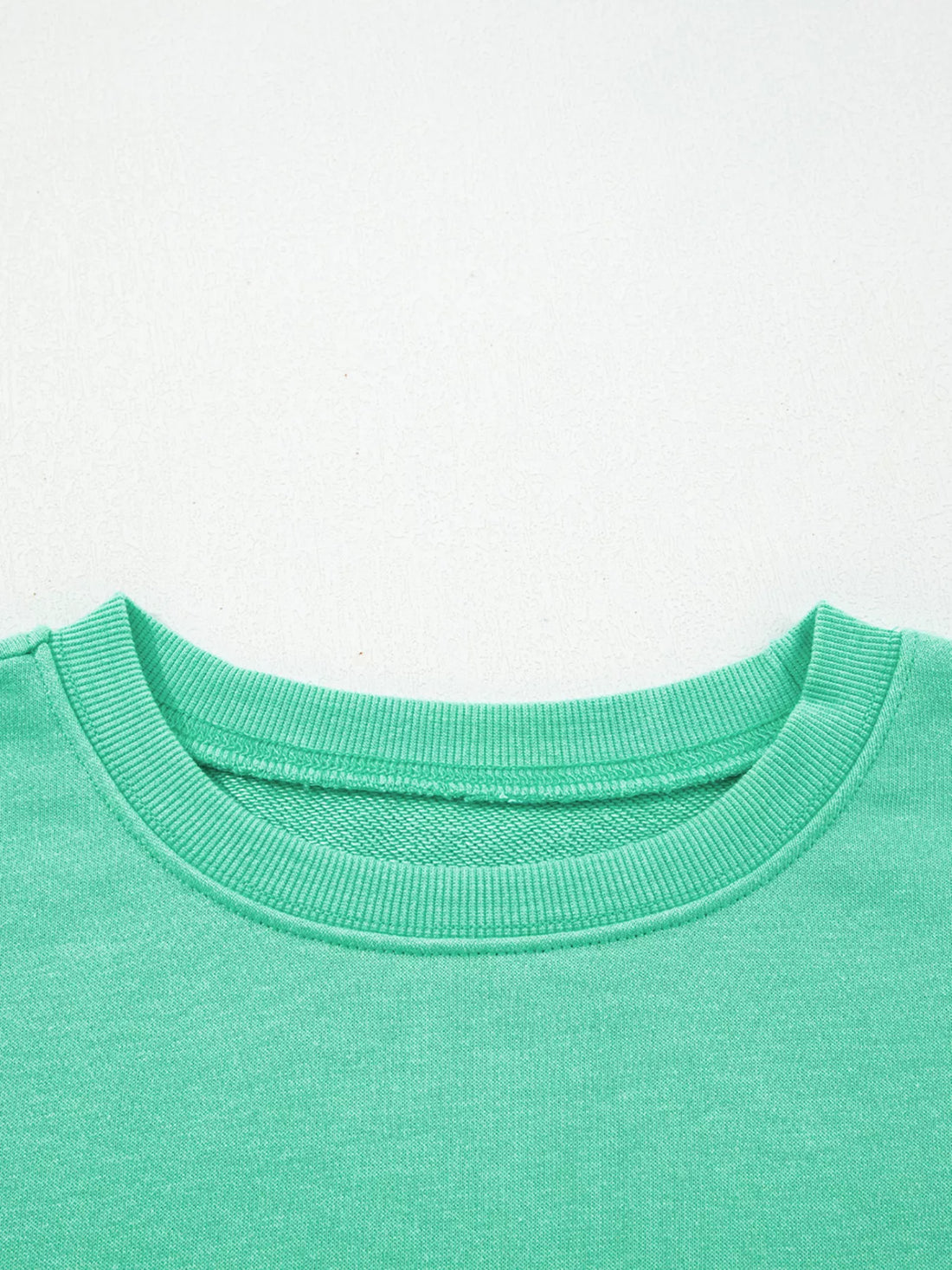 Turquoise crewneck sweatshirt collar with ribbed neckline trim