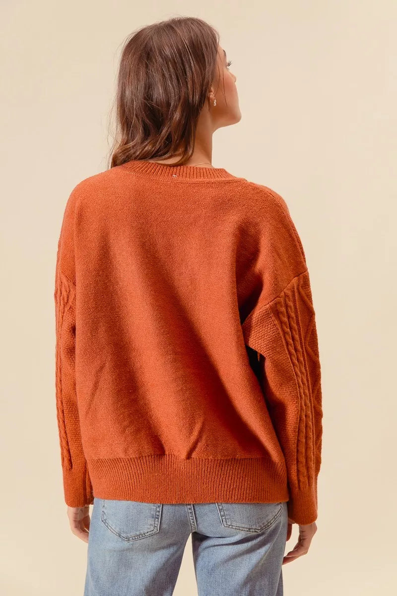 Brick back view cable-knit sweater with ribbed hem and long sleeves