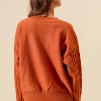 Brick back view cable-knit sweater with ribbed hem and long sleeves