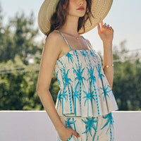 Blue palm-print smocked cami top with adjustable straps and tiered peplum hem