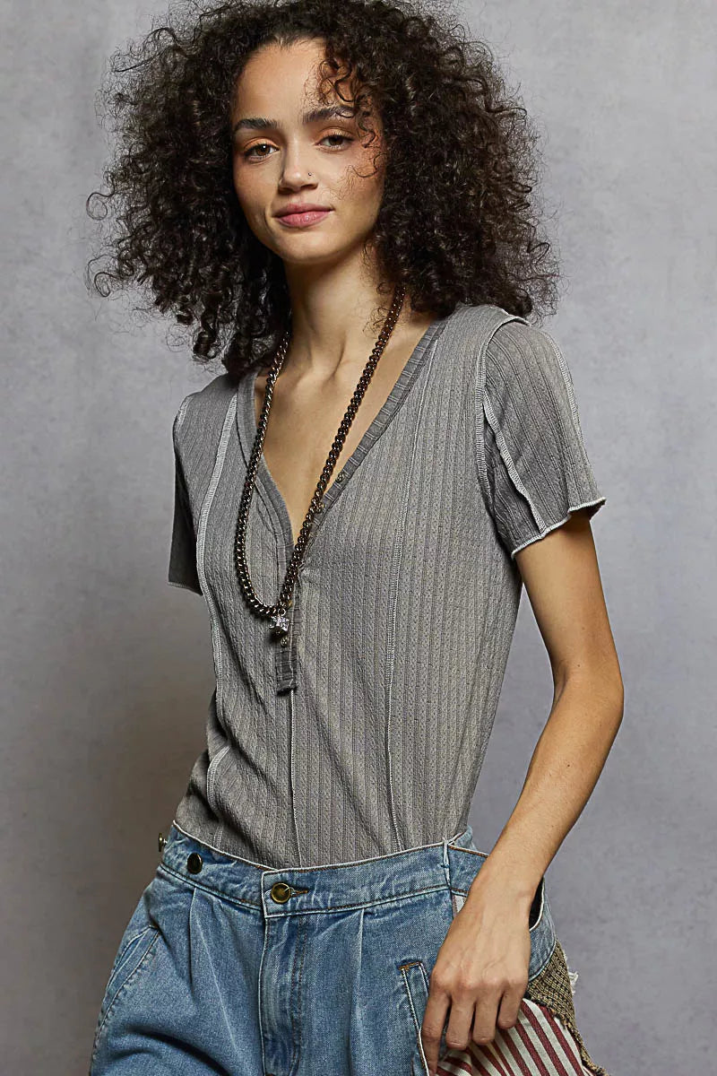 Grey pinstripe V-neck short sleeve top with stitch seam detail, three-quarter view