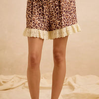 Leopard print shorts with drawstring waist and eyelet lace ruffle hem