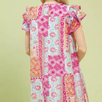Back view pink patchwork mini dress with flutter sleeves and panel stitching