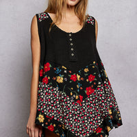 Black ribbed tank top with floral woven patch, button front, uneven hem