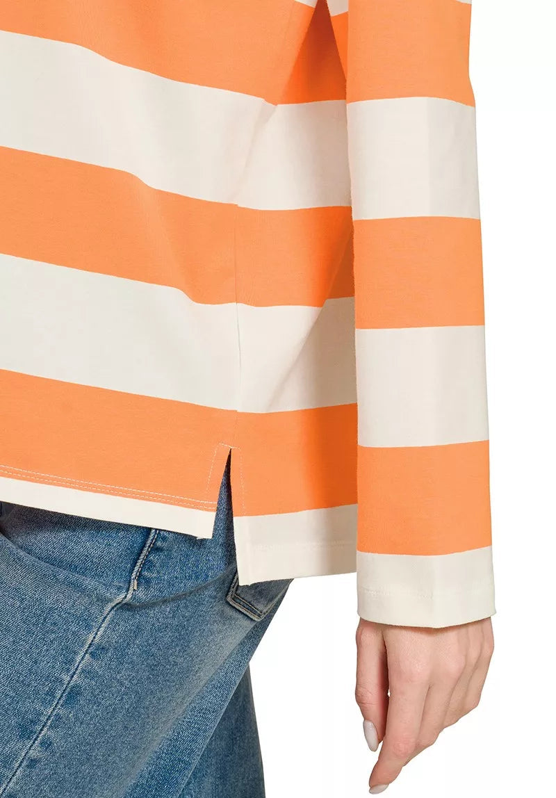 Orange and white striped polo top with side slit at hem and long sleeve cuff