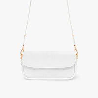 White mini shoulder bag with textured flap and thin gold chain shoulder strap.
