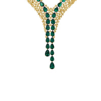 Gold-plated statement necklace with emerald-green teardrop gems and gold chain