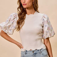 White knit sweater top with short puff floral sleeves and scalloped hemline