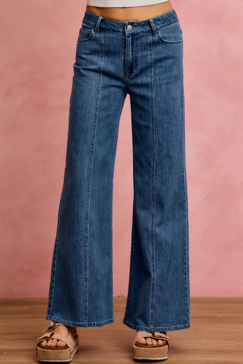 Mid-rise stretch denim jeans, front view with button closure and center seam