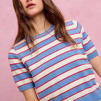 Short-sleeve striped knit sweater top with crew neck; blue hem and cuffs, red and white lines