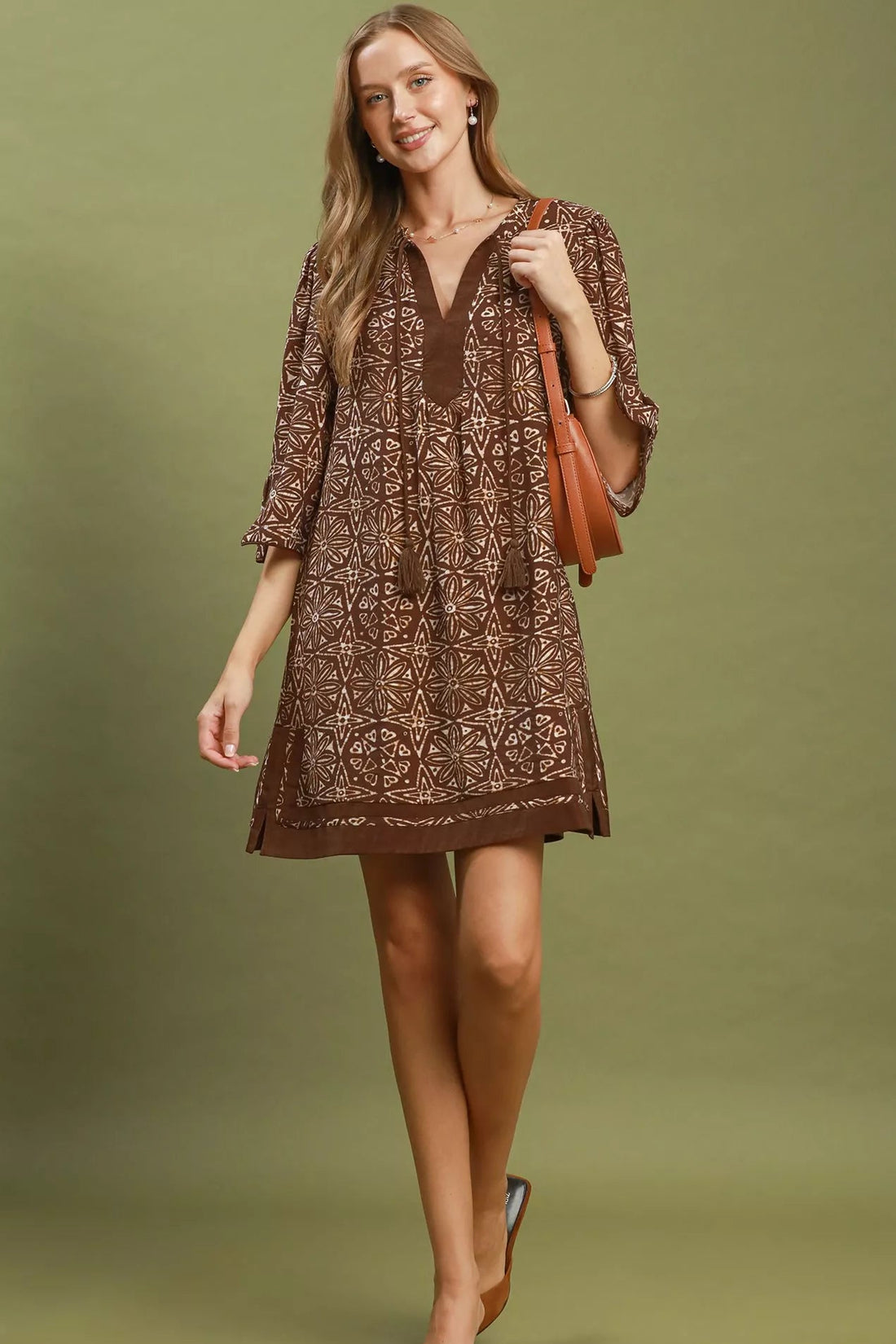 Brown geometric print V-neck tunic dress with tassel tie and above-knee length