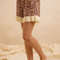 Leopard print shorts with eyelet lace ruffle hem, side view