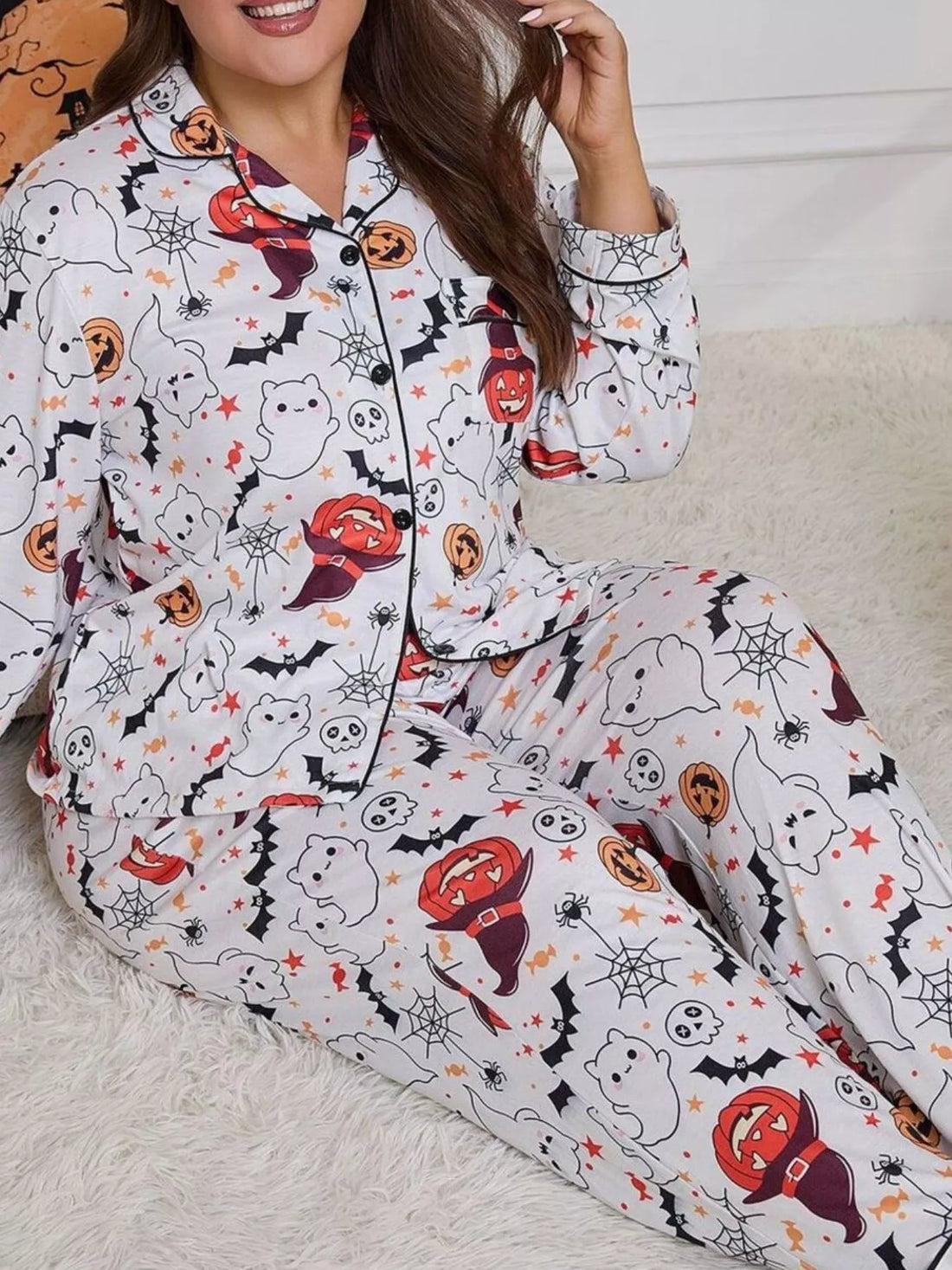 Plus size Halloween pajama set in white with ghost, pumpkin, and bat allover print