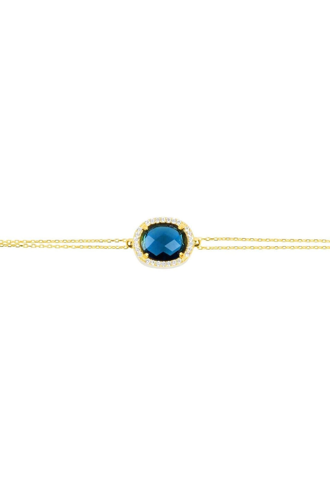 Gold oval blue gemstone bracelet close-up on chain
