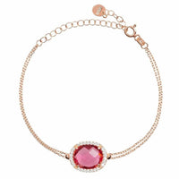 Rose gold oval gemstone bracelet with pink center gem and halo setting