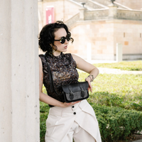 Black leather micro crossbody satchel with tweed front, flap and long shoulder strap