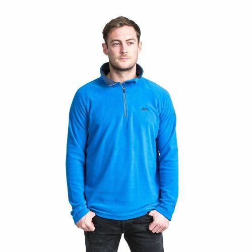 Man wearing a bright blue microfleece quarter-zip top