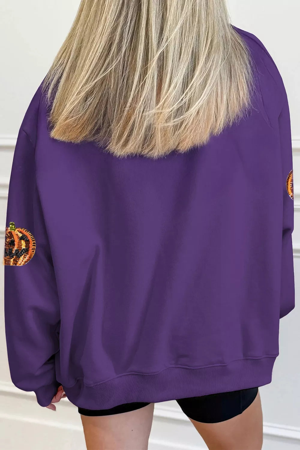 Violet Halloween sweatshirt back with scattered pumpkin sequin details