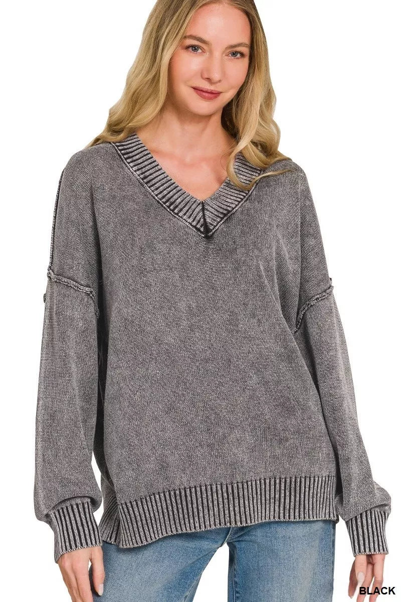Washed dark gray oversized sweater with deep V-neck and ribbed cuffs