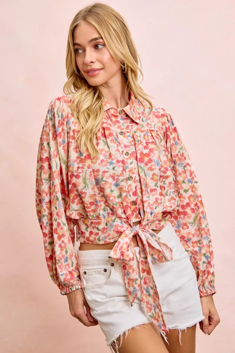 Floral print crop shirt with button front, ruffled yoke, and tied front hem