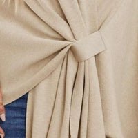 Ivory shawl cape knot and pleated tie at the center front