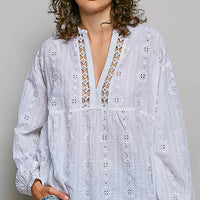 Off-white cotton long-sleeve blouse with V-neck and lace eyelet detail