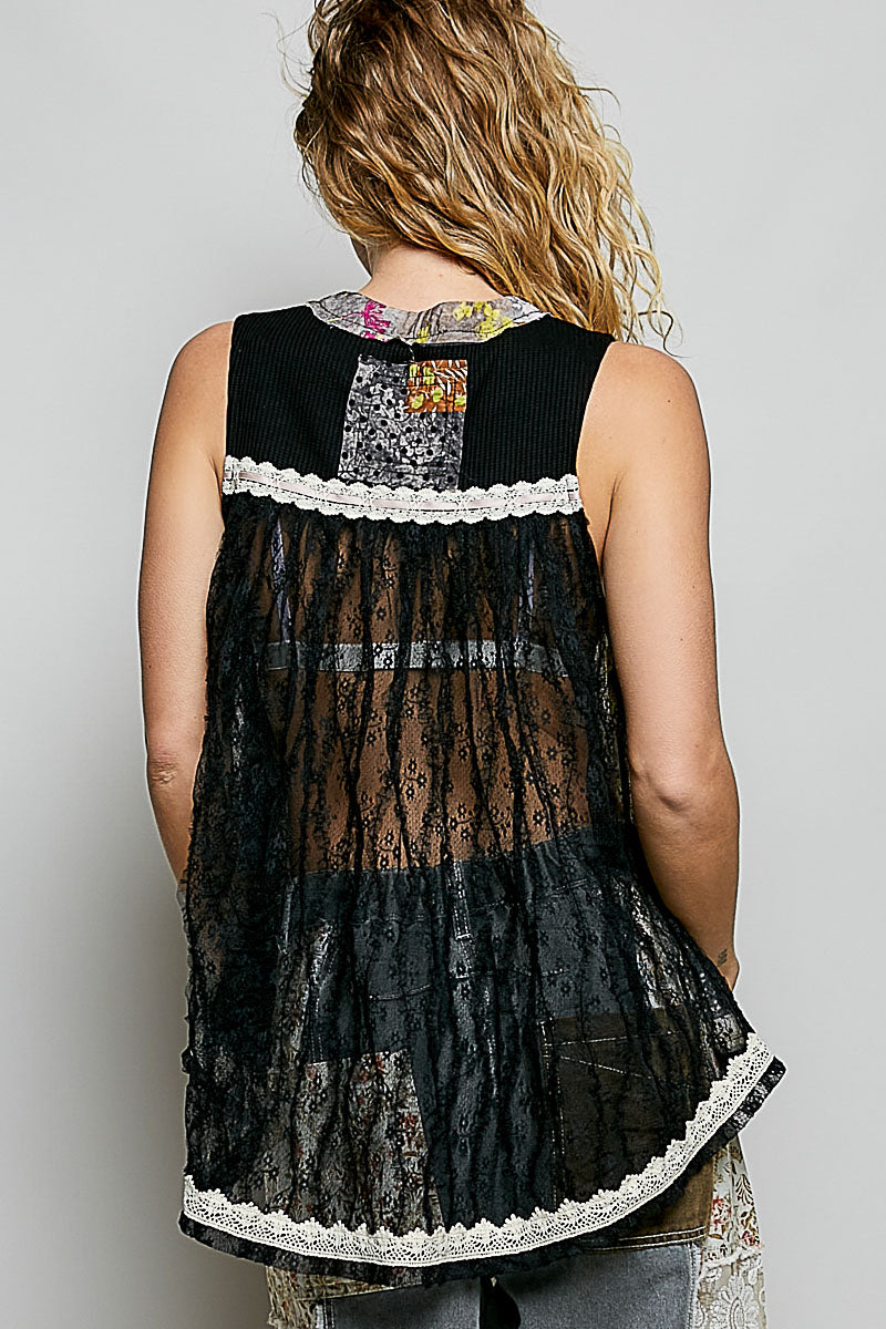 Black sheer floral tank with lace trim and patchwork panels, shown from the back