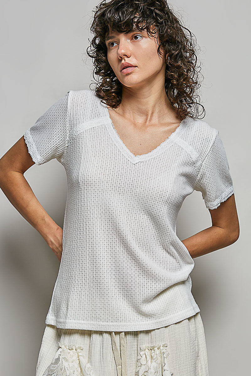 Off-white textured V-neck short-sleeve lace-detail t-shirt, front view
