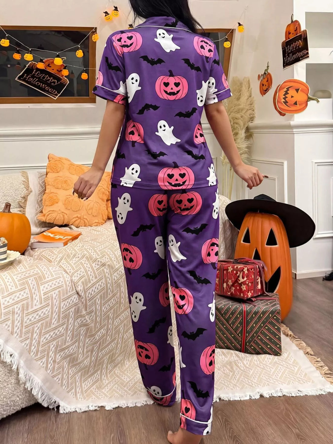 Purple Halloween pajama set with button-front short-sleeve top and long pants, ghost and pumpkin print