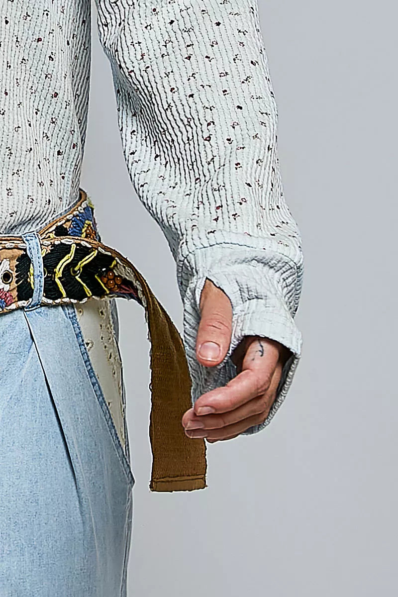 Light blue speckled knit long sleeve with elastic cuff and textured ribbing